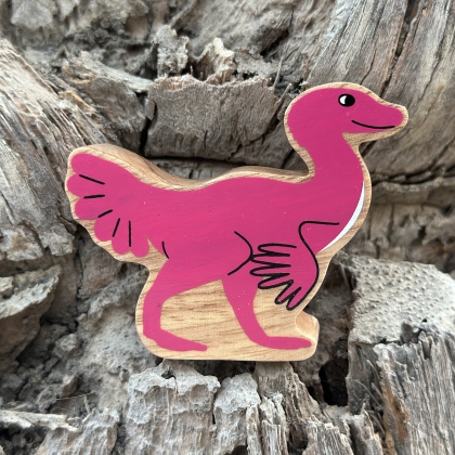 Wooden pink caudipteryx toy