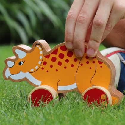 Wooden triceratops push along toy
