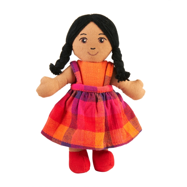Soft toy boy rag doll with brown skin, black hair wearing multicoloured dress