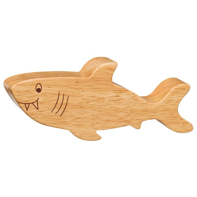 A chunky wooden shark toy figure in profile, plain with wood grain