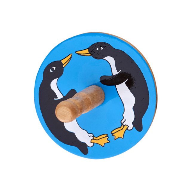 birds eye view of a blue spinning top with a design of a two penguins