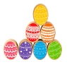 A stack of wooden toy rainbow eggs in profile