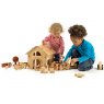 Children playing with wooden toy farm playset on the floor