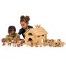Children playing with wooden toy farm playset on a table