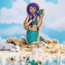 A chunky wooden green and purple toy mermaid figure