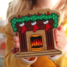 Wooden fireplace with stockings toy