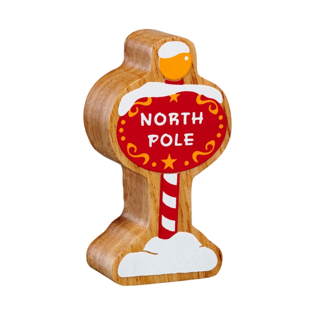 A chunky wooden North Pole toy figure in profile with a natural wood edge