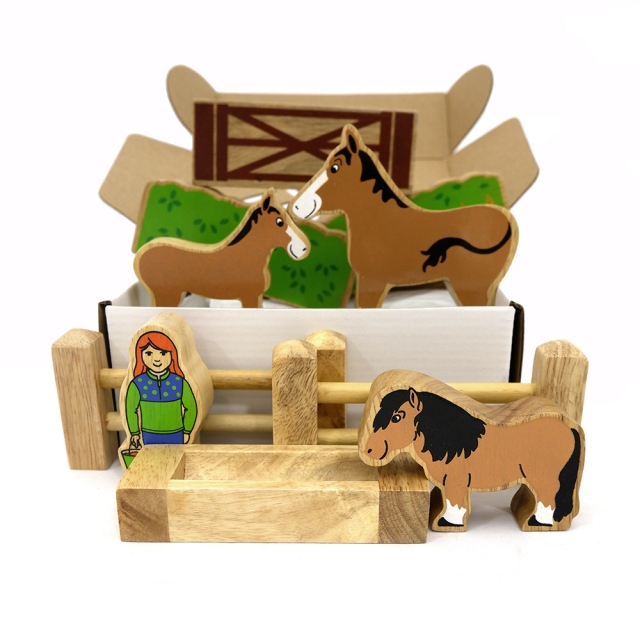 Wooden toy set containing 11 pieces including animals, people, fences, hedges, gate and trough.