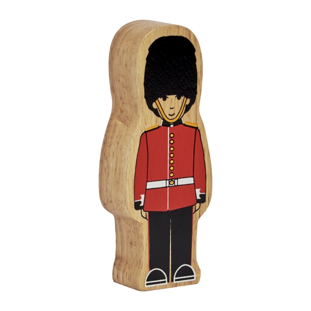 A wooden toy Guardsman wearing red uniform and bearskin