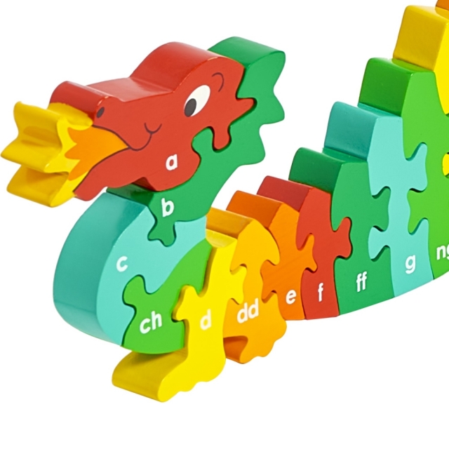 Twenty six piece chunky wooden multicoloured dragon welsh alpahbet jigsaw puzzle in profile