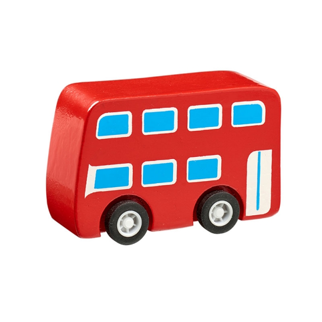 Imperfect mini red bus made from FSC certified rubber wood photographed in situ