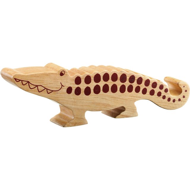 A chunky wooden crocodile toy figure in profile, plain with wood grain