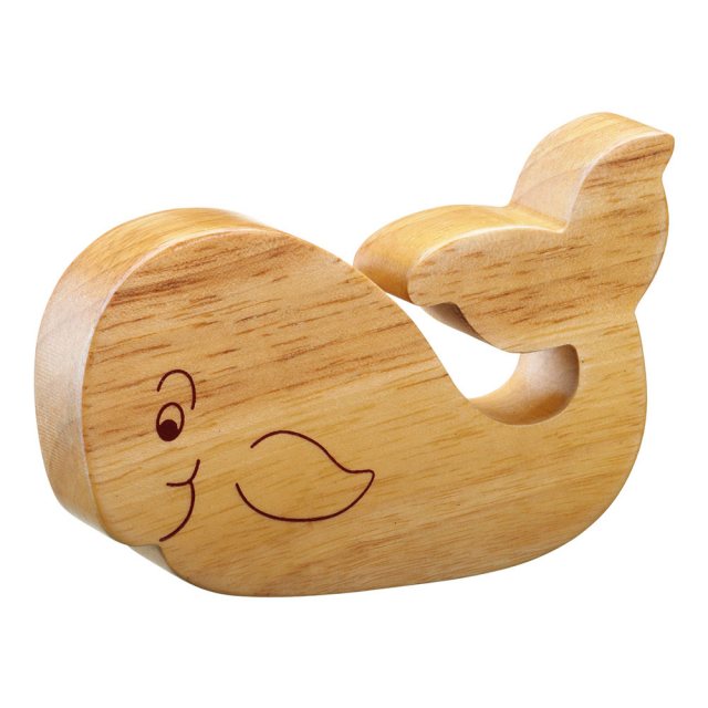A chunky wooden whale toy figure in profile, plain with wood grain