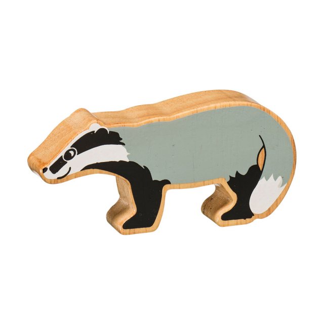 A chunky wooden grey badger toy figure in profile with a natural wood edge