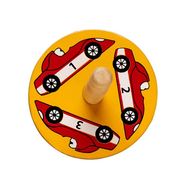 birds eye view of a yellow spinning top with a design of a three racing cars