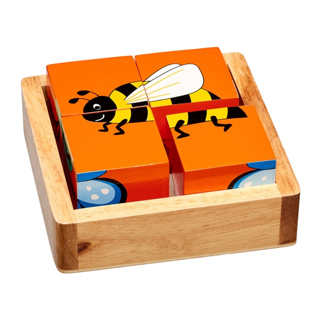 Four piece minibeast block puzzle showing orange side with bee design in a plain wooden tray