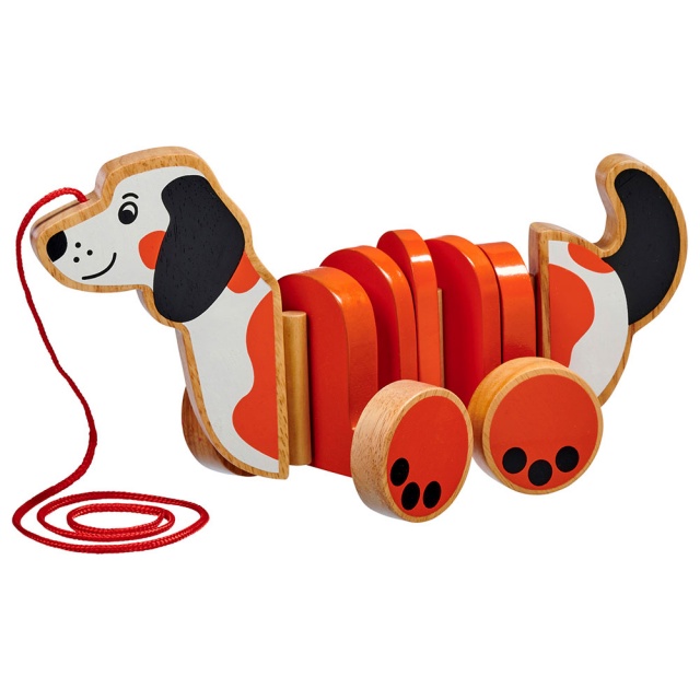 White, orange and black dog pull along toy with four wheels and red string