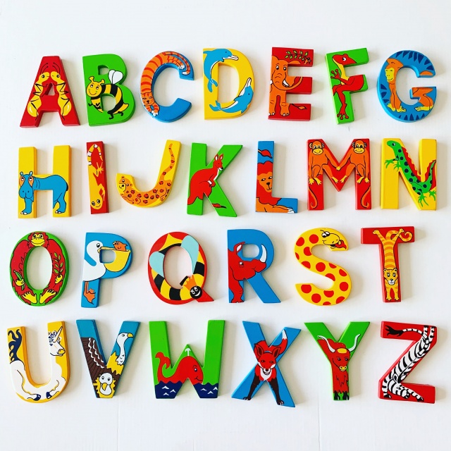 Set of 26 wooden letters in different colours displayed from A to Z