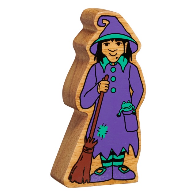 A chunky wooden purple and green toy witch figure in profile with a natural wood edge