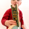 Child playing with firefighter on a ladder wooden toy figure