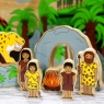Cave family around wooden fire and cave toy with Sabretooth Tiger