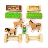 Birds eye view of childrens wooden toy horse playset existing of 11 pieces.