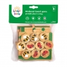 A wooden board game shown in net bag packaging with colourful card sleeve