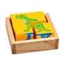 Four piece dinosaur block puzzle showing yellow size with T-Rex design in a plain wooden tray
