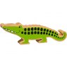 A chunky wooden green crocodile toy figure in profile with a natural wood edge