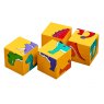 Four piece yellow dinosaur block puzzle showing varying parts of dinosaurs on each cube