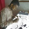 Sri Lankan artisan hand making the screens used to paint design onto boats