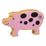 A wooden toy pink pig in profile with a natural wood grain edge