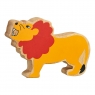 A wooden toy red and yellow lion in profile with a natural wood grain edge