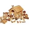 Children playing with wooden toy farm playset on the floor