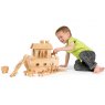 Child playing with small natural wood Noah's ark and characters on the floor