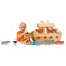 Child playing with natural wood Noah's ark boat and characters, holding onto ostrich figurine