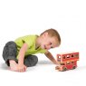 Child playing with red wooden double decker bus playset on the floor