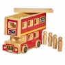 Child playing with red wooden double decker bus playset on the floor