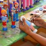 Sri lankan artisan skilfully handpainting a pirate skittle