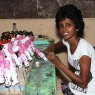 Sri Lankan artisan skilfully handpainting floral design onto a wooden skipping rope handle