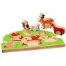 Wooden green tree shape sorter tray with six removable colourful animals stood up.