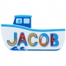 Small, flat wooden name plaque in white fishing boat design with Jacob spelt in blue letters