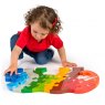 Child playing with rainbow elephant 1-10 jumbo size jigsaw puzzle on the floor