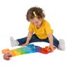 Child playing with rainbow dog 1-10 jumbo size jigsaw puzzle on the floor