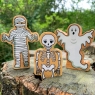 A chunky wooden white toy skeleton figure