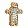 A chunky wooden white toy mummy figure in profile with a natural wood edge