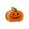 A chunky wooden orange toy pumpkin figure with a Halloween carved design in profile with a natural w
