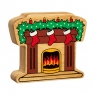 A chunky wooden fireplace with stockings figure in profile with a natural wood edge