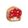 Reverse of chunky wooden red and white toadstool toy figure in profile